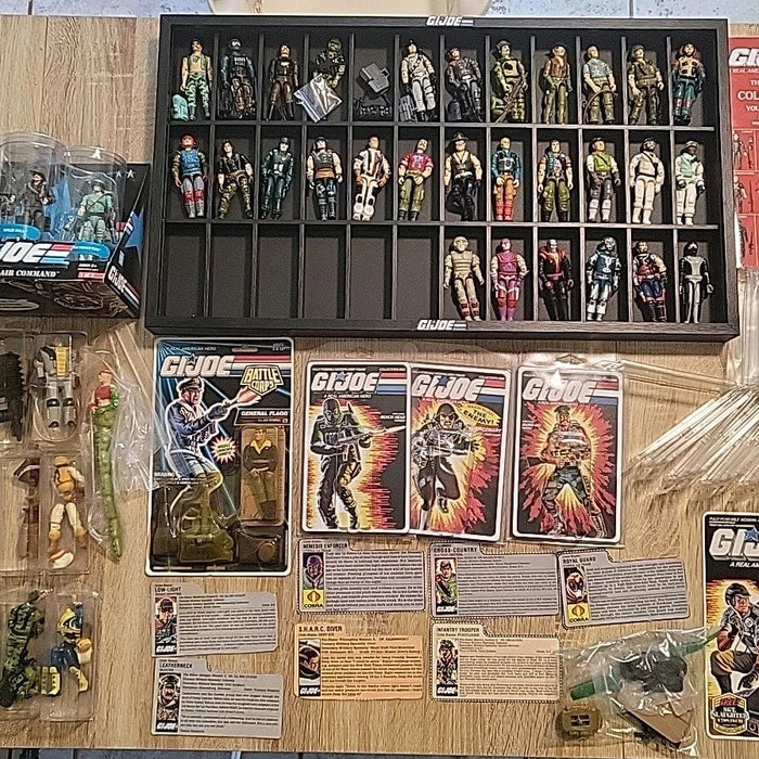 Vintage 1980s action figures found in a storage box including Star Wars and other classic toys