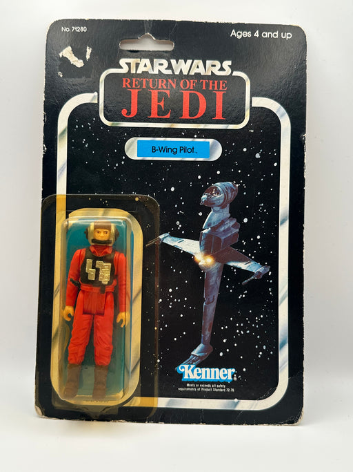 1983 Kenner Star Wars B-Wing Pilot MOC front view 77 back card
Vintage Star Wars B-Wing Pilot sealed figure bubble close-up
Return of the Jedi B-Wing Pilot cardback collect all 77 layout
Kenner B-Wing Pilot figure bubble clarity and yellowing detail
Star Wars B-Wing Pilot card edge wear and corner condition close-up
Vintage Kenner Star Wars cardback figure lineup detail 77 back
B-Wing Pilot punch hole condition close-up vintage Kenner
1983 Kenner B-Wing Pilot packaging back barcode and proof of purchase sea