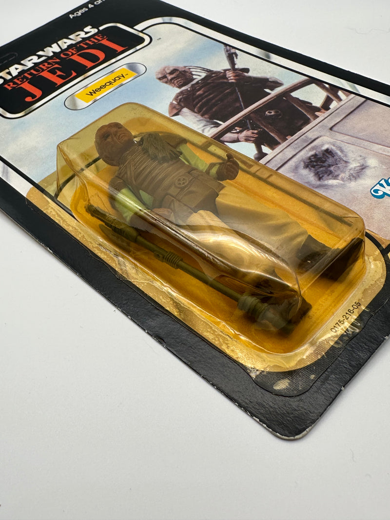 1983 Kenner Star Wars Weequay ROTJ 77 back MOC unpunched front view
Weequay ROTJ Kenner vintage figure yellow bubble close-up
Unpunched hang tab detail Weequay 77 back card
Side profile bubble dent Weequay ROTJ figure
Angled view Kenner Star Wars Weequay MOC carded figure
Collect All 77 back detail Weequay ROTJ Kenner card
