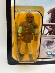 1983 Kenner Star Wars Weequay ROTJ 77 back MOC unpunched front view
Weequay ROTJ Kenner vintage figure yellow bubble close-up
Unpunched hang tab detail Weequay 77 back card
Side profile bubble dent Weequay ROTJ figure
Angled view Kenner Star Wars Weequay MOC carded figure
Collect All 77 back detail Weequay ROTJ Kenner card
