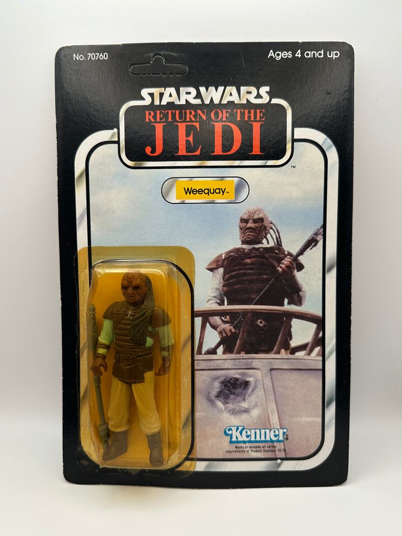 1983 Kenner Star Wars Weequay ROTJ 77 back MOC unpunched front view
Weequay ROTJ Kenner vintage figure yellow bubble close-up
Unpunched hang tab detail Weequay 77 back card
Side profile bubble dent Weequay ROTJ figure
Angled view Kenner Star Wars Weequay MOC carded figure
Collect All 77 back detail Weequay ROTJ Kenner card
