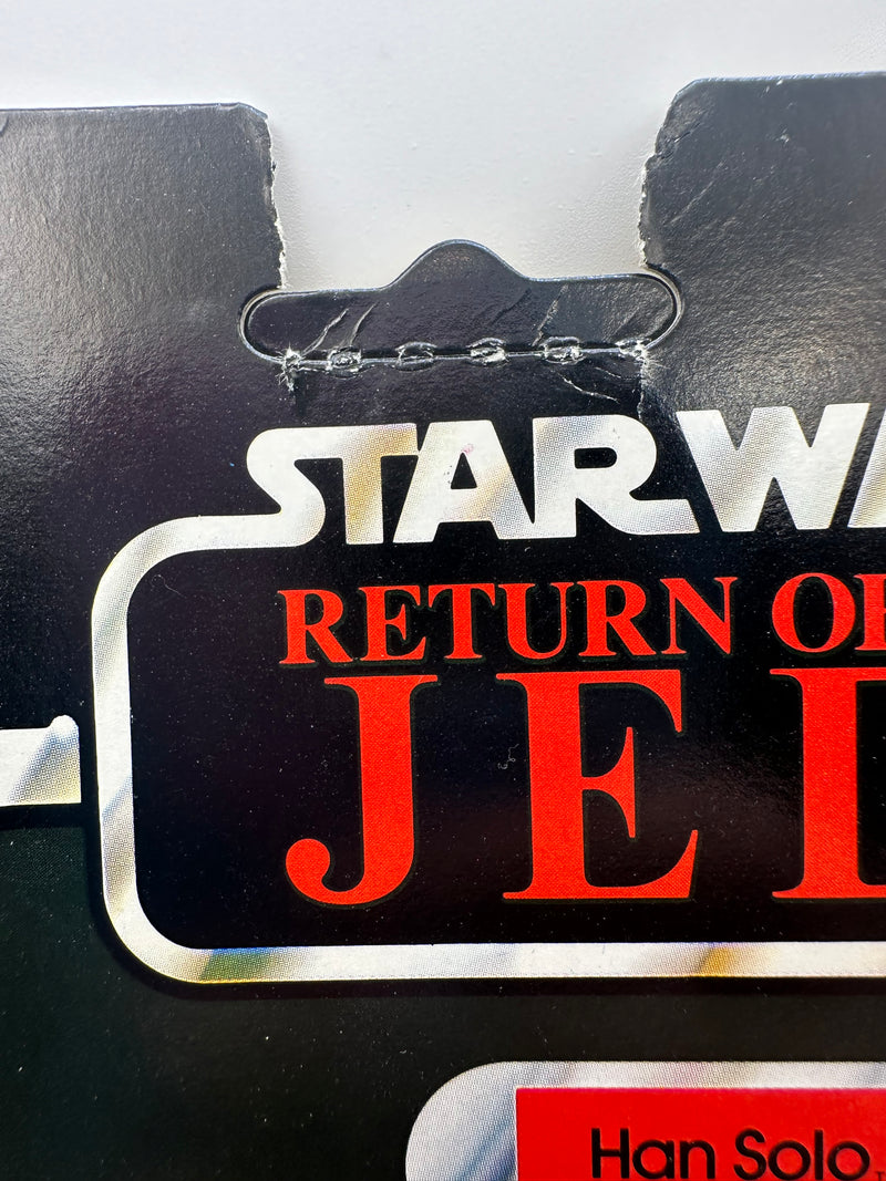 1983 Kenner Star Wars Return of the Jedi Han Solo Trench Coat 77 Back factory sealed MOC action figure with original camouflage trench coat and blaster accessory