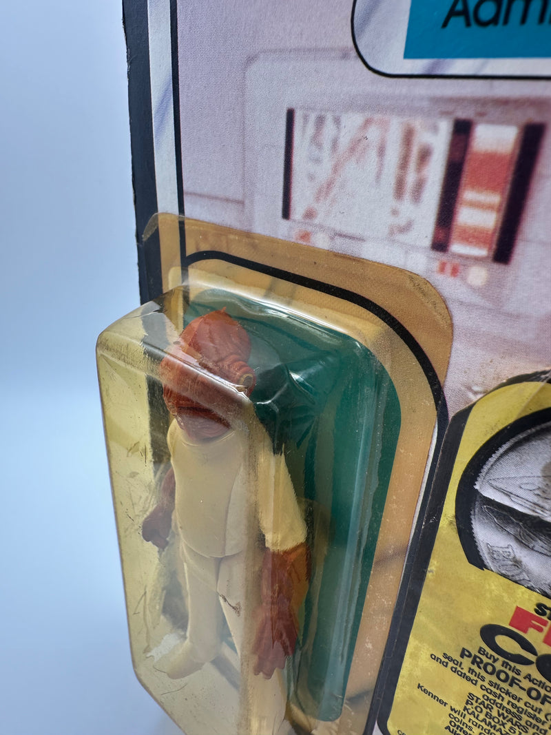 Vintage 1983 Kenner Star Wars Admiral Ackbar Return of the Jedi 65 back MOC sealed action figure with coin offer, yellowed bubble with visible crack, unpunched card with hanger wear, front view collectible
