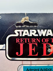 Vintage 1983 Kenner Star Wars Admiral Ackbar Return of the Jedi 65 back MOC sealed action figure with coin offer, yellowed bubble with visible crack, unpunched card with hanger wear, front view collectible
