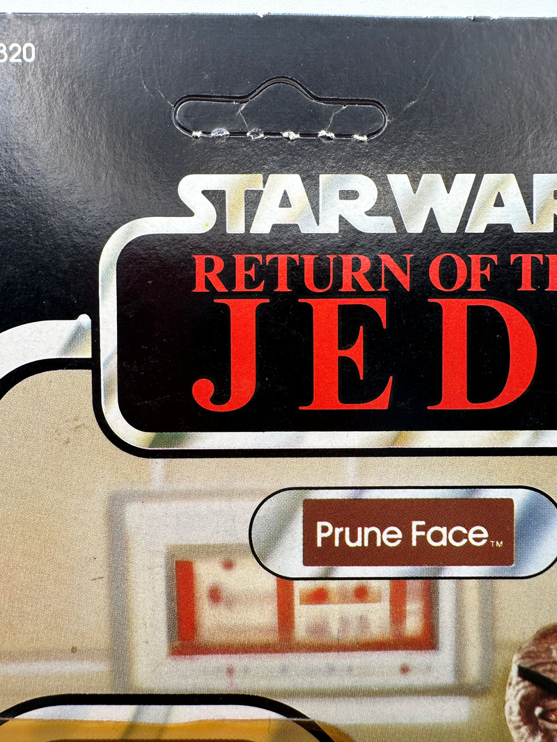vintage 1984 kenner star wars prune face 77 back moc front view
prune face figure sealed bubble close up vintage kenner
rotj 77 back hanger area wear around punch detail
vintage star wars anakin offer sticker close up
kenner prune face bubble side profile yellowing warping
vintage star wars card back collect all 77 prune face