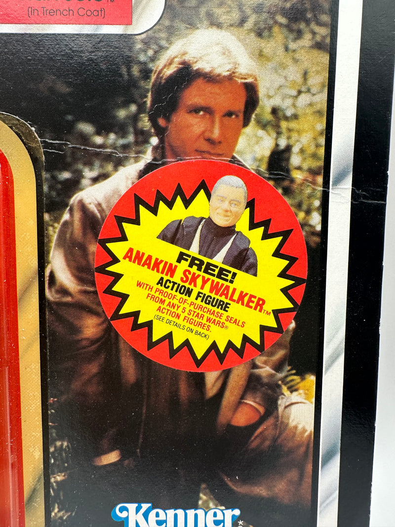 Han Solo Trench Coat ROTJ 77 back unpunched MOC with Anakin sticker front view
Close-up Han Solo figure sealed in original Kenner bubble
Anakin Skywalker offer sticker detail May 30 1985
ROTJ 77 back Collect All 77 lineup
Side profile showing amber bubble tone
Unpunched hanger detail with light stress
Full front Han Solo trench coat MOC
Back of card Kenner checklist